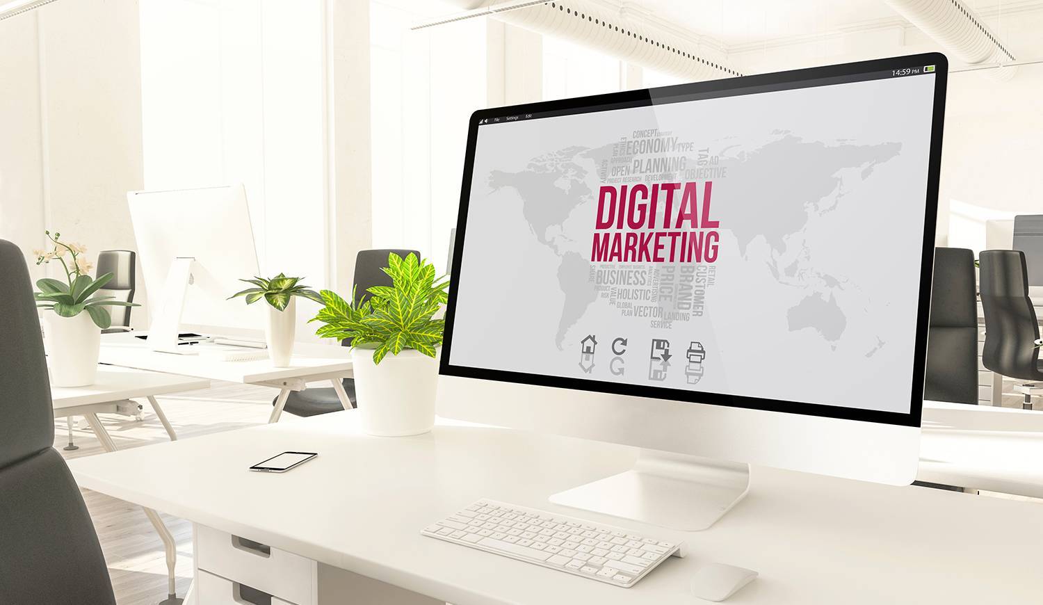 Computer screen on white desk displaying the words digital marketing in bright pink